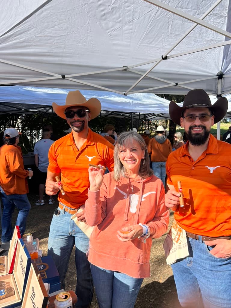 Mayfin cigars shared during an outdoor community event