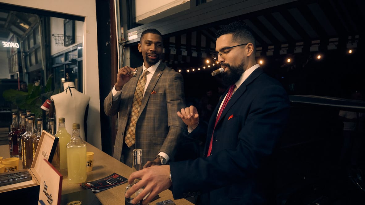 Mayfin team sharing cigars during a community gathering