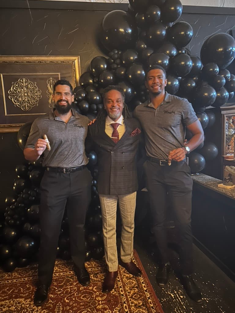 Mayfin team with a lounge owner during a cigar event