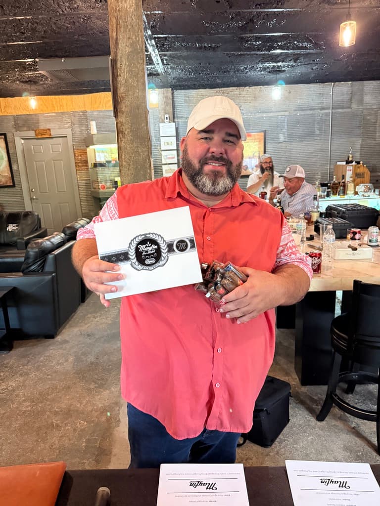 A lounge guest holding a Mayfin release certificate