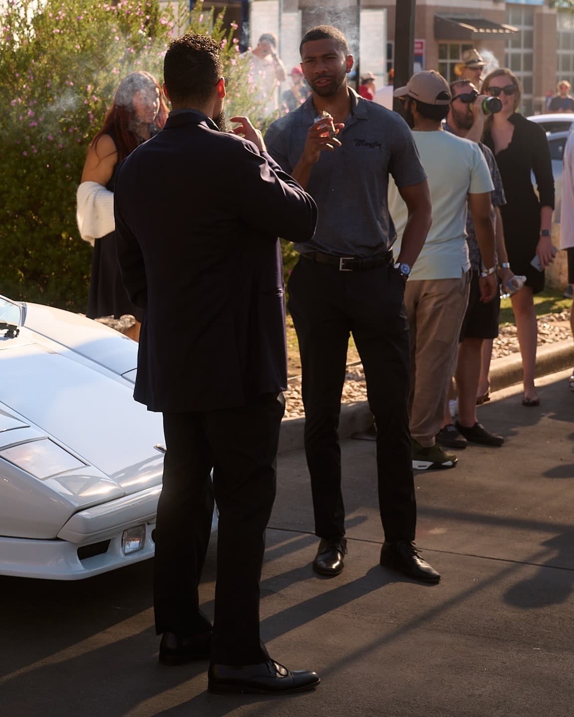 Mayfin team talking with guests during an outdoor community gathering